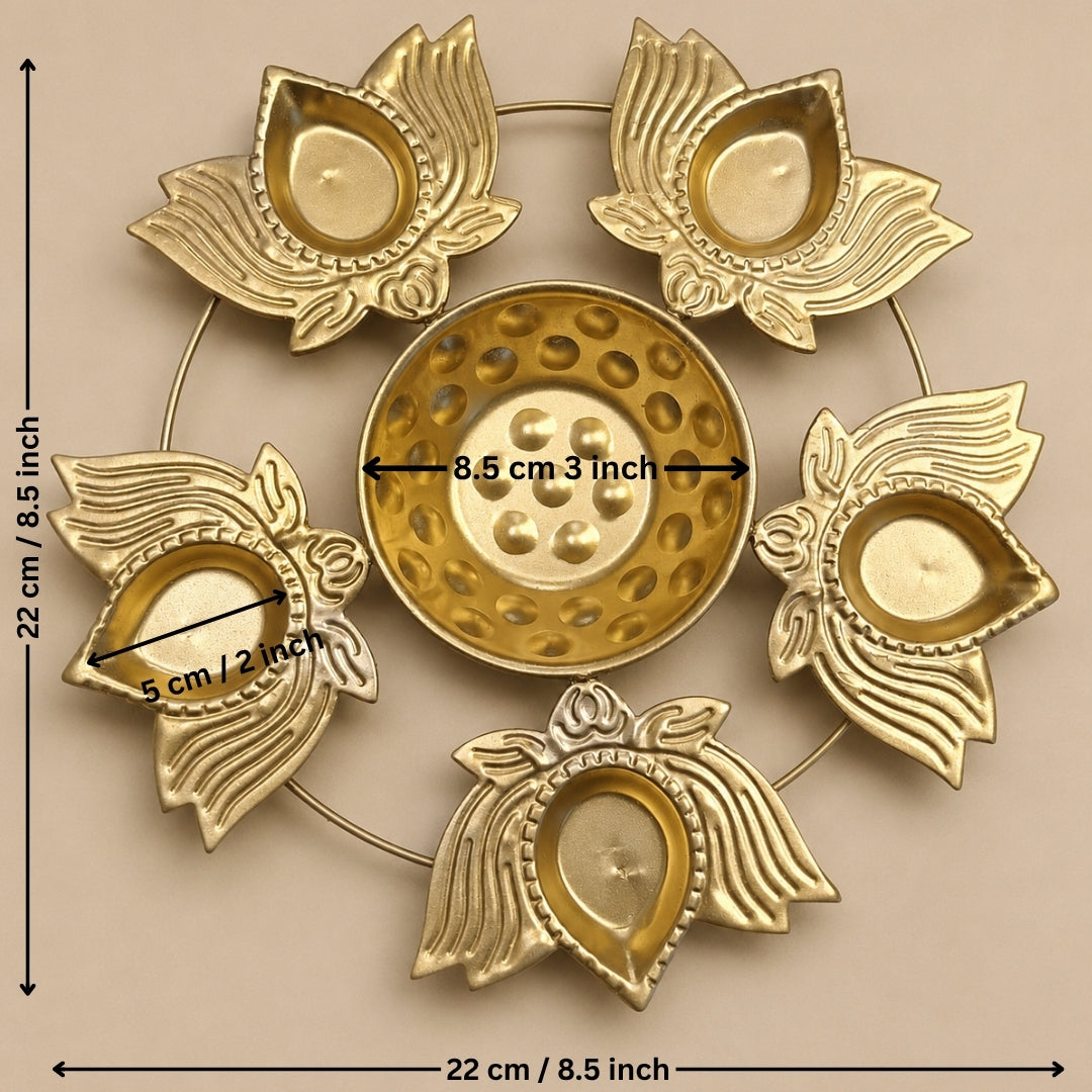 A brass diya holder set with a central round holder and four petal-shaped side holders arranged in a circle, shown on a beige background with measurement labels indicating 22 cm diameter and 8.5 cm center diameter.