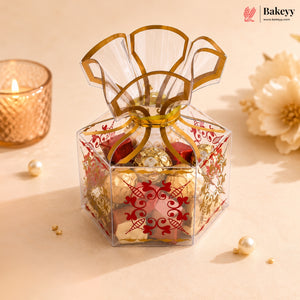 Decorative gift box with gold ribbon on a beige background, featuring Bakeyy branding.