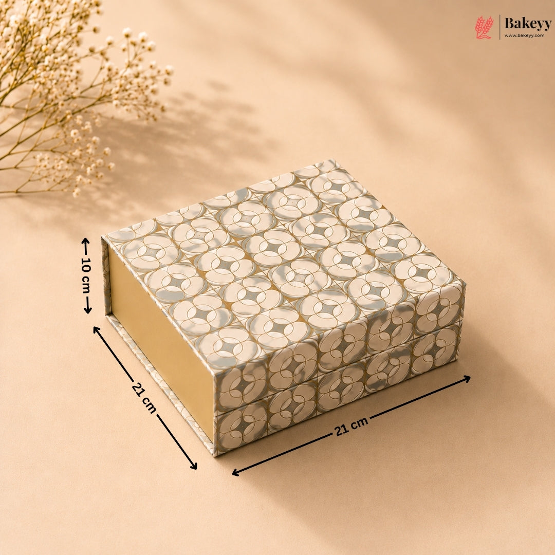 Decorative box with floral pattern and measurements on a beige background, featuring the brand 'Bakeyy'.