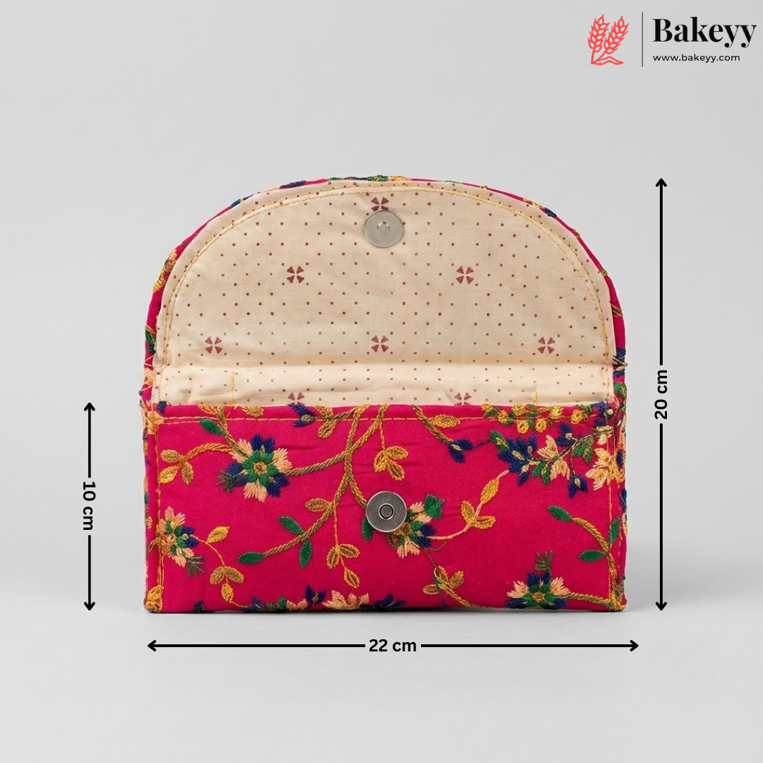 A fabric pouch bag with a bright pink floral front pocket and a beige dotted arched top flap, shown with dimension lines indicating 22 cm width, 20 cm height, and 10 cm depth on a light gray background. Bakeyy logo is visible in the top right.