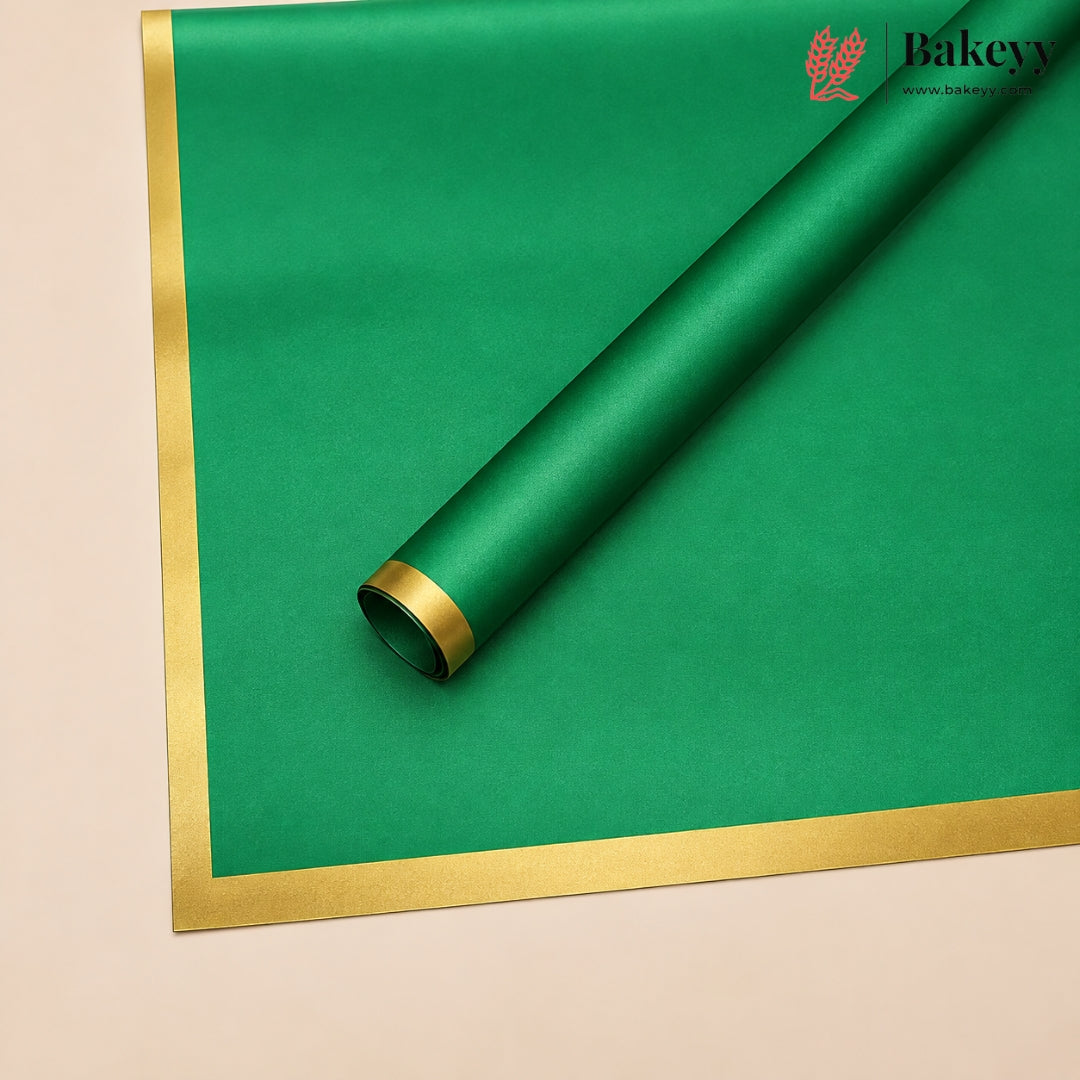 A roll of green bakery wrapping paper with a metallic gold border, shown partially unrolled on a light beige background. The Bakey brand logo is visible in the top right corner.