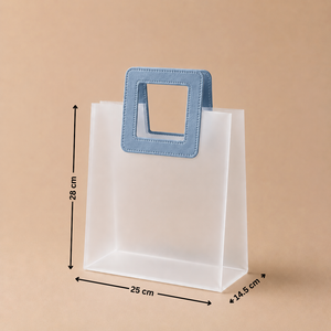 White paper bag with a blue handle and measurements on a beige background