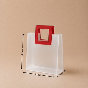 White paper bag with a red handle and measurements on a beige background