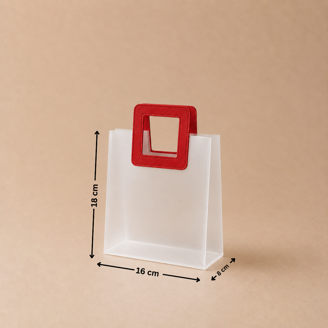 White paper bag with a red handle and measurements on a beige background