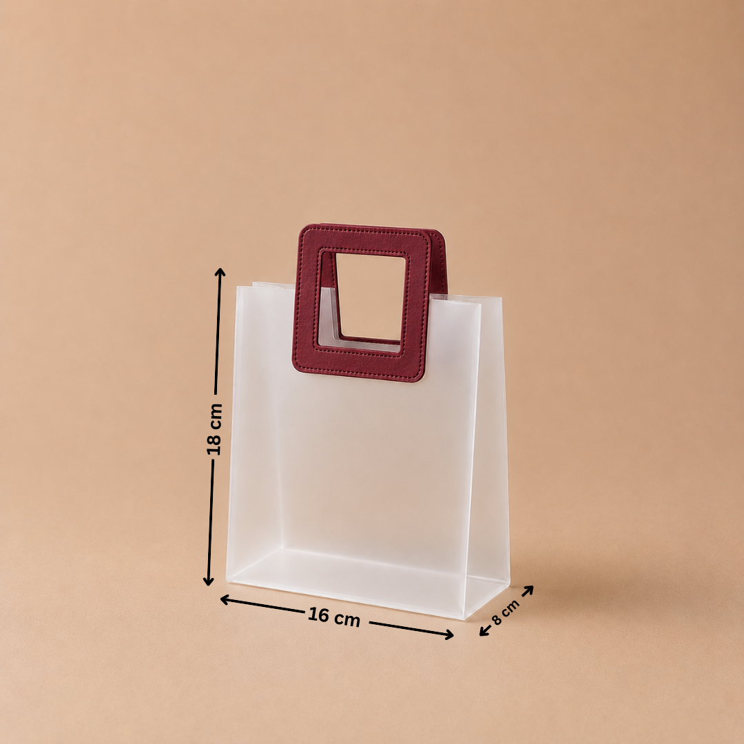 Clear plastic bag with a red handle and measurements on a beige background