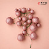 Decorative pink glittery spheres on a beige background with 'Bakeyy' branding.