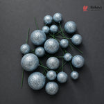 Decorative blue glittery spheres on a dark background with 'Bakeyy' branding.