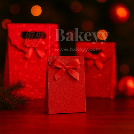 Red gift boxes with ribbons on a dark background, featuring the brand 'Bakeyy'.