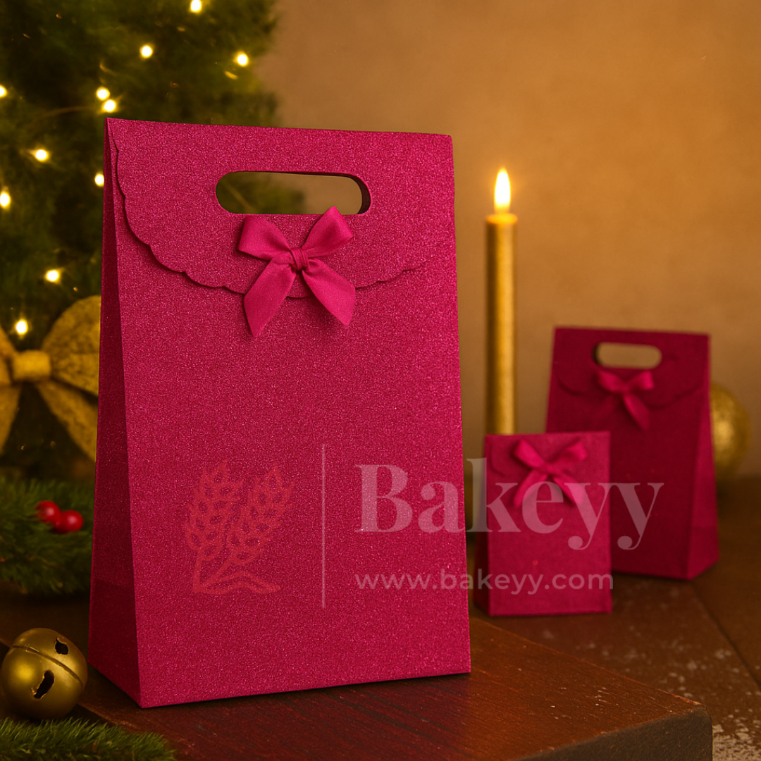 Pink gift bag with a bow and 'Bakeyy' branding in a festive setting.