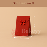 Red gift bag with a bow and measurements on a beige background, featuring the brand 'Bakeyy'.