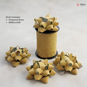 Gold glittery ribbons with prepared bows on a white background, featuring Bakeyy branding.