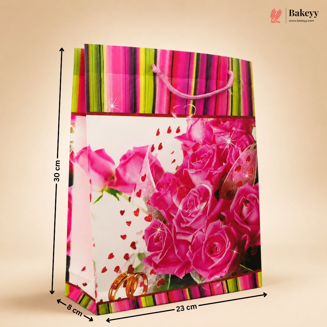 Gift bag with pink roses and colorful stripes, dimensions indicated, on a beige background