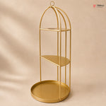 Gold metal shelf with three tiers on a beige background