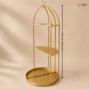 Gold three-tiered shelf with dimensions on a beige background