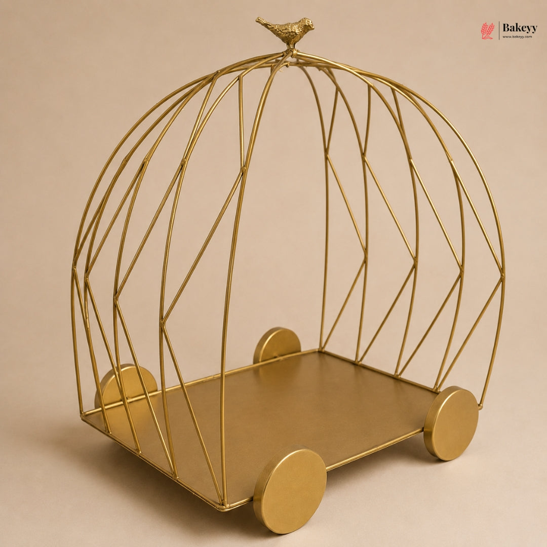 Gold wire birdcage-shaped shelf on a beige background