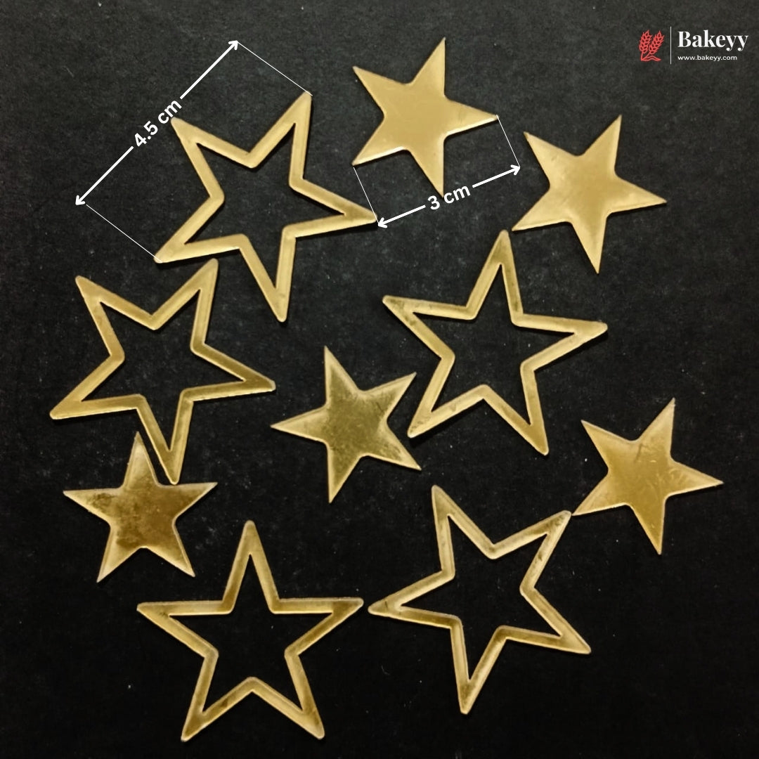 Nine gold-colored star-shaped metal beads or charms arranged on a black background, with white dimension lines and text indicating 4.5 cm by 3 cm measurements.