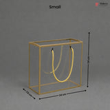 Small gold jewelry display box with dimensions on a gray background