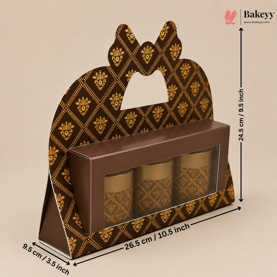 A brown and gold patterned bakery gift box with a handle cutout, shown with dimension arrows and labels indicating 26.5 cm length, 9.
