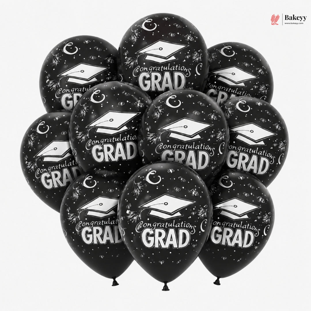 Black balloons with 'Congratulations Grad' text and graduation caps on a white background