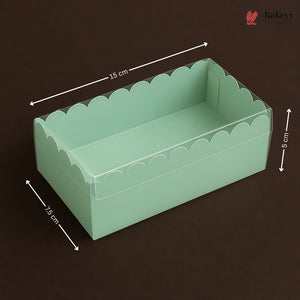 Green scalloped-edge box with dimensions on a dark background