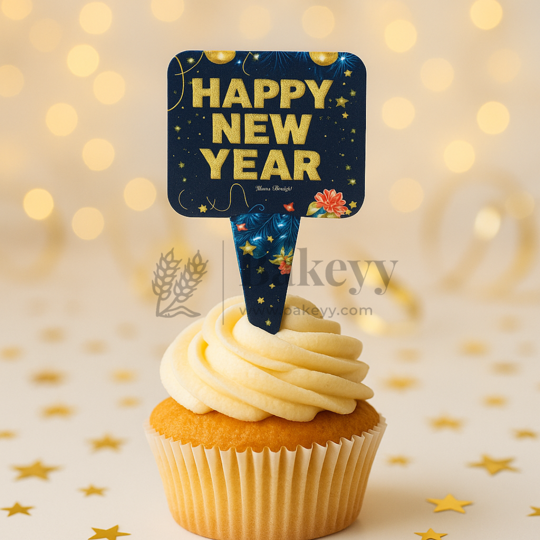 Cupcake with a 'Happy New Year' decoration on a soft bokeh background