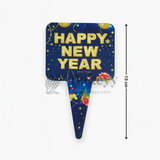 Decorative sign with 'Happy New Year' text on a blue background with stars and colorful elements.