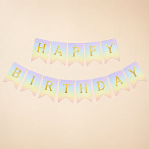 Pastel-colored 'Happy Birthday' banner with gold letters on a beige background