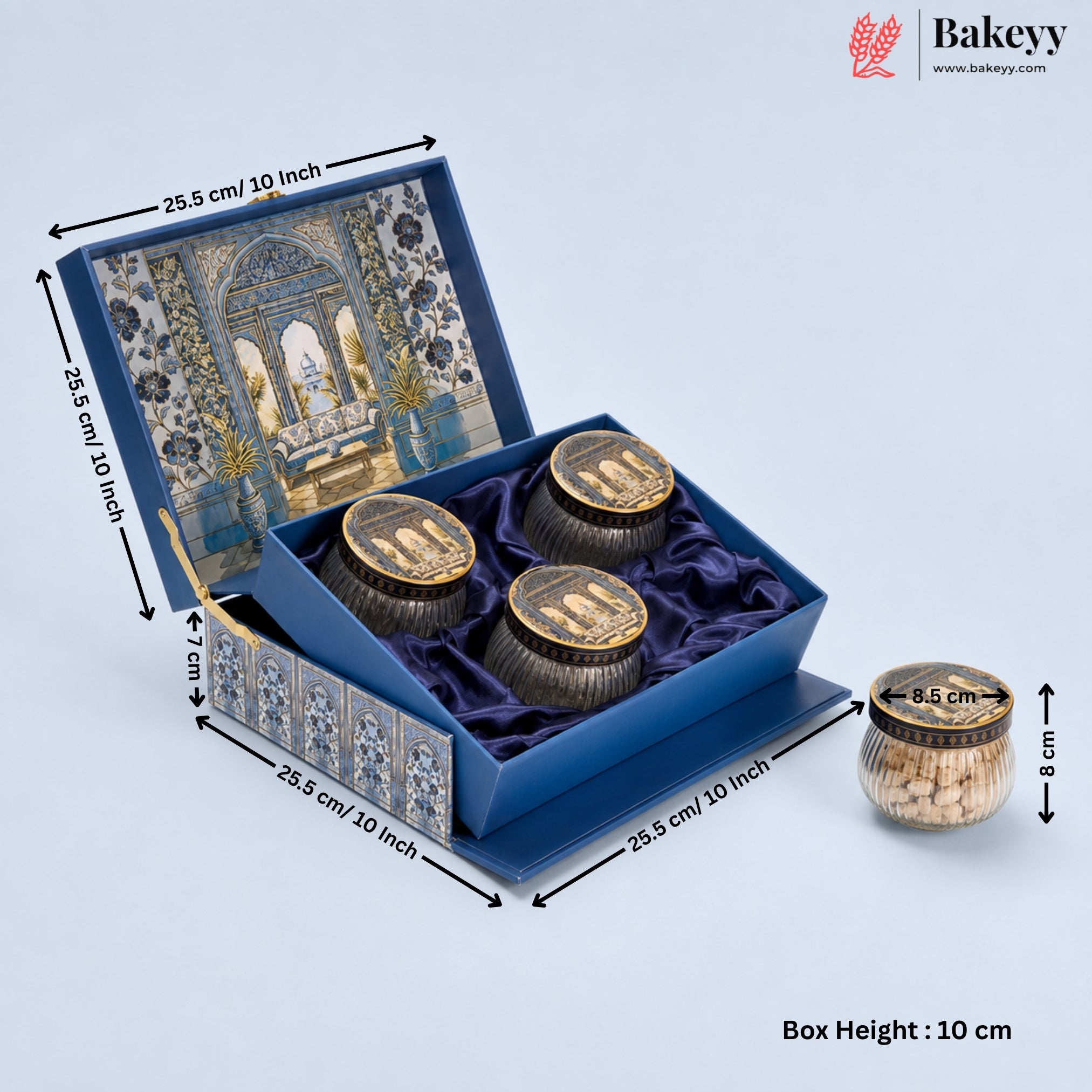 An ornate blue presentation box for three small jars of baklava, shown open with dimension annotations. The box features a detailed archway illustration on the inner lid, blue velvet lining, and decorative side panels.