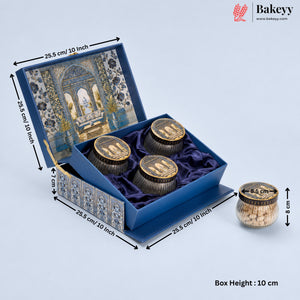 An ornate blue presentation box for three small jars of baklava, shown open with dimension annotations. The box features a detailed archway illustration on the inner lid, blue velvet lining, and decorative side panels.