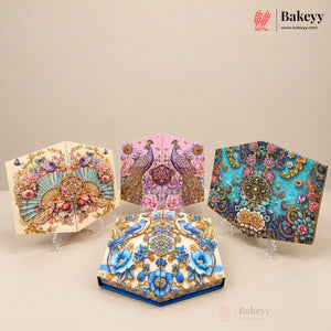 Four decorative 3D box cakes displayed on clear acrylic stands against a warm beige background. The cakes feature intricate 3D floral and peacock designs in vibrant colors including turquoise, pink, cream, and gold.