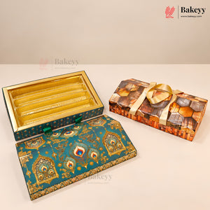 Three decorative rectangular bakery boxes displayed on a light beige surface against a warm beige background. One box is open, showing gold-lined compartments, while the other two are closed and feature ornate teal, gold, and multicolor printed designs with a gold ribbon on one.