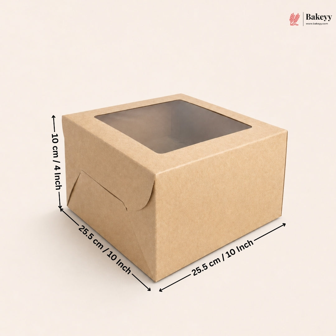 A square brown kraft paper bakery box with a clear window on top, shown with dimension arrows and labels indicating 25.5 cm by 25.