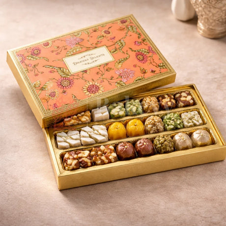Premium Rigid Floral Printed Box
Gold Finished Inner Base
3 Separate Long Compartments
Transparent Food Grade Plastic Inserts
Perfect for Sweets, Chocolates &amp; Dry Fruits
Ideal for Festive &amp; Wedding Gifting