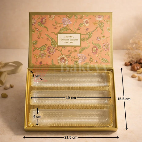 Premium Rigid Floral Printed Box
Gold Finished Inner Base
3 Separate Long Compartments
Transparent Food Grade Plastic Inserts
Perfect for Sweets, Chocolates &amp; Dry Fruits
Ideal for Festive &amp; Wedding Gifting