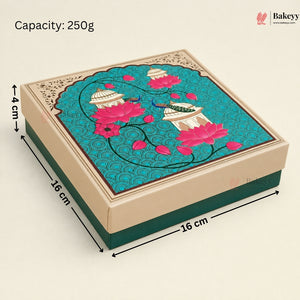 A square decorative cake box shown at an angle with dimension labels indicating 16 cm by 16 cm by 4 cm. The lid features a turquoise background with pink lotus flowers, white domed motifs, and ornate beige border details.