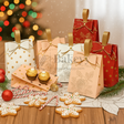 Decorative gift bags with festive cookies and a Christmas tree in the background