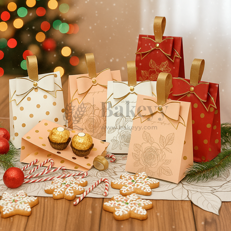 Decorative gift bags with festive cookies and a Christmas tree in the background