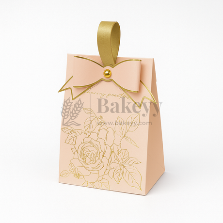 Beige gift box with gold floral design and bow on a white background