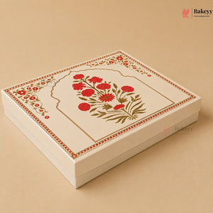 A square cream-colored gift box with a decorative lid featuring a red floral arch motif and gold border details, set against a solid beige background.