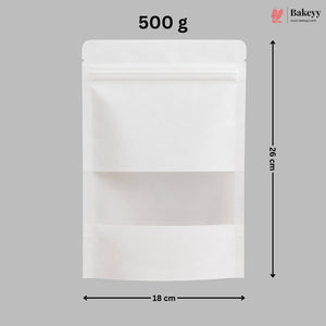 A white stand-up resealable pouch shown on a gray background with dimension arrows and text indicating 18 cm width, 26 cm height, and 500 g weight. A Bakeyy logo appears in the top right.