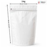 A white stand-up resealable pouch with a zipper and a small round vent hole, shown with dimension arrows indicating 23 cm width and 34 cm height, plus text reading 2 Kg and a Bakeey logo.