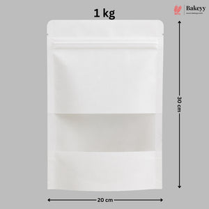 A white stand-up pouch packaging bag with a zipper closure and a clear window, shown with dimension markings of 30 cm height and 20 cm width on a gray background, with a Bakeyy logo in the top right.