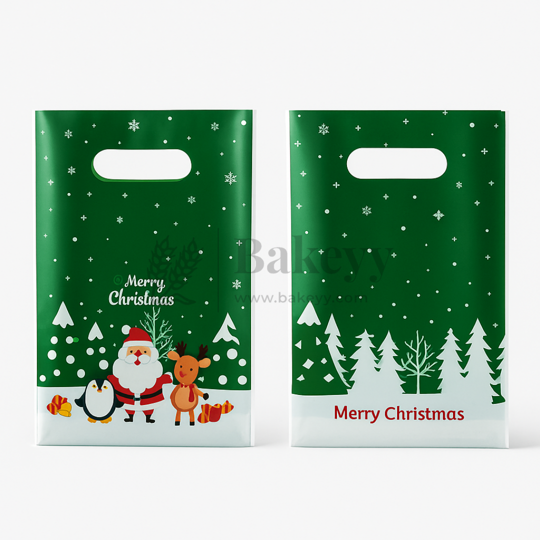 Two green Christmas-themed gift bags with Santa Claus, reindeer, penguin, and trees on a white background.