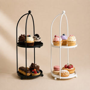 Two tiered dessert stands with pastries on a beige background