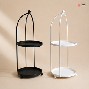 Black and white metal stands with round trays on a beige background
