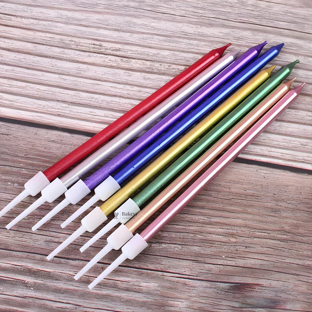 Metallic straight birthday cake candles with holders in assorted colors on wood, Bakeyy.com