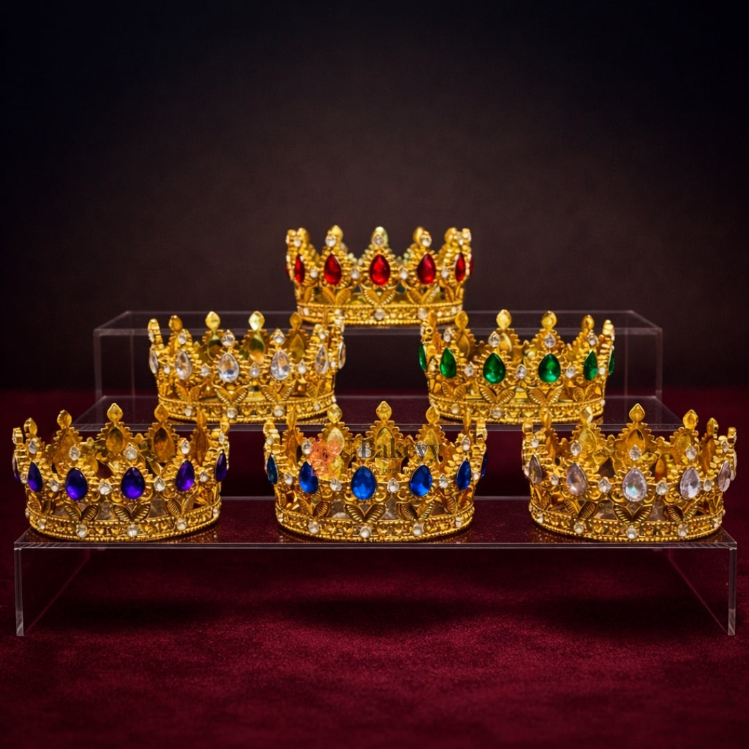 Elegant royal crown design with crystal stones
Premium gold finish with detailed carving
Lightweight and easy to place on cakes
Reusable decorative topper
Perfect for birthday cakes, themed cakes, baby shoots, and table décor
Available in multiple stone color variants