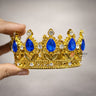 Elegant royal crown design with crystal stones
Premium gold finish with detailed carving
Lightweight and easy to place on cakes
Reusable decorative topper
Perfect for birthday cakes, themed cakes, baby shoots, and table décor
Available in multiple stone color variants