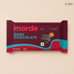 Dark chocolate bar packaging with 'morde' branding on a beige background