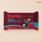 Dark chocolate bar packaging with 'morde' branding on a beige background
